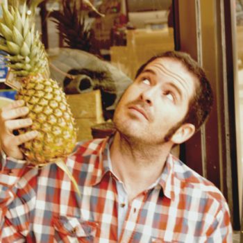 Digs1_1 Digs, the sweet potato's President and Founder holding a pineapple outside our first location in the Junction